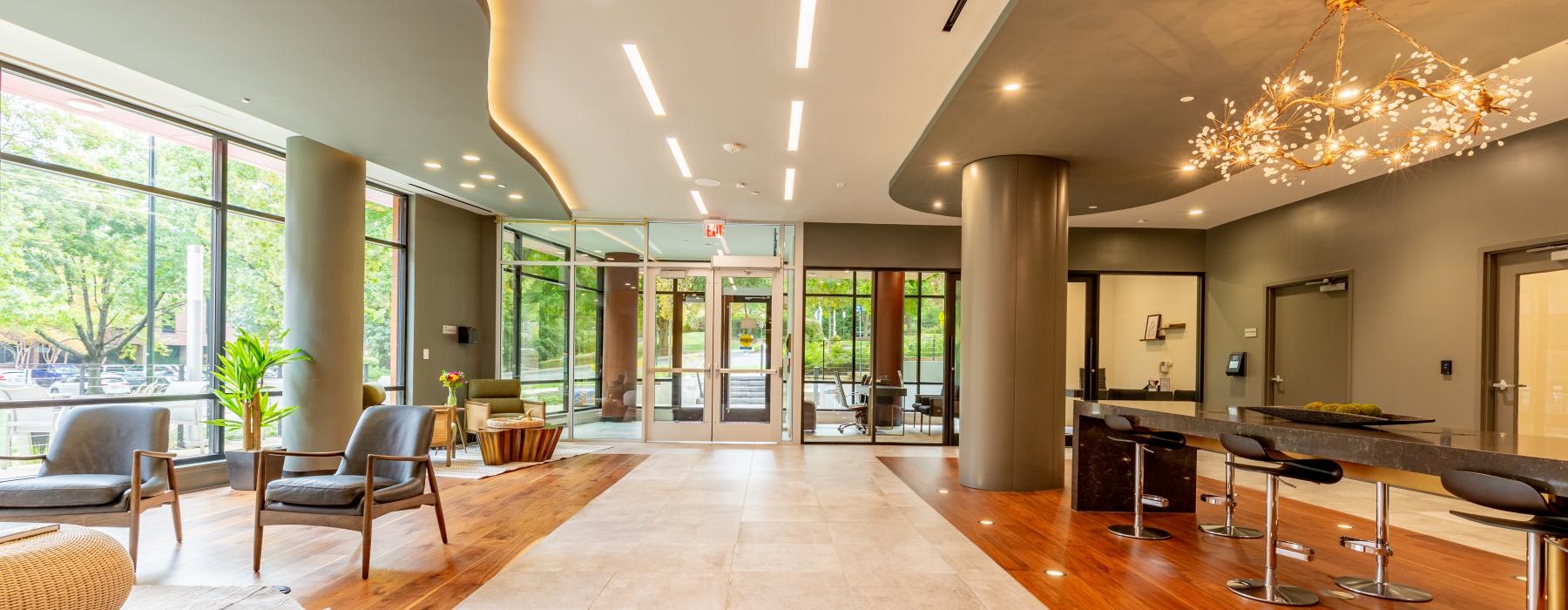 large lobby with seating areas and stylized lighting throughout